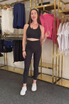 women wearing black squat proof 7/8 high waist phone pocket tights