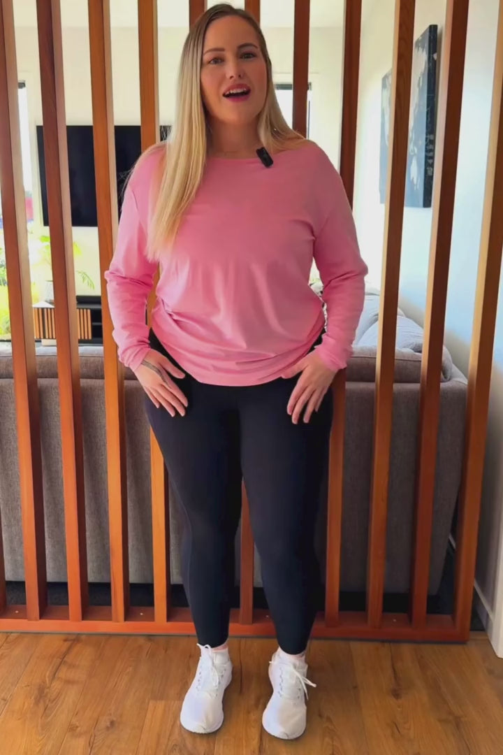 Curvy women wearing black non roll down leggings.