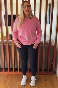 Curvy women wearing black non roll down leggings.