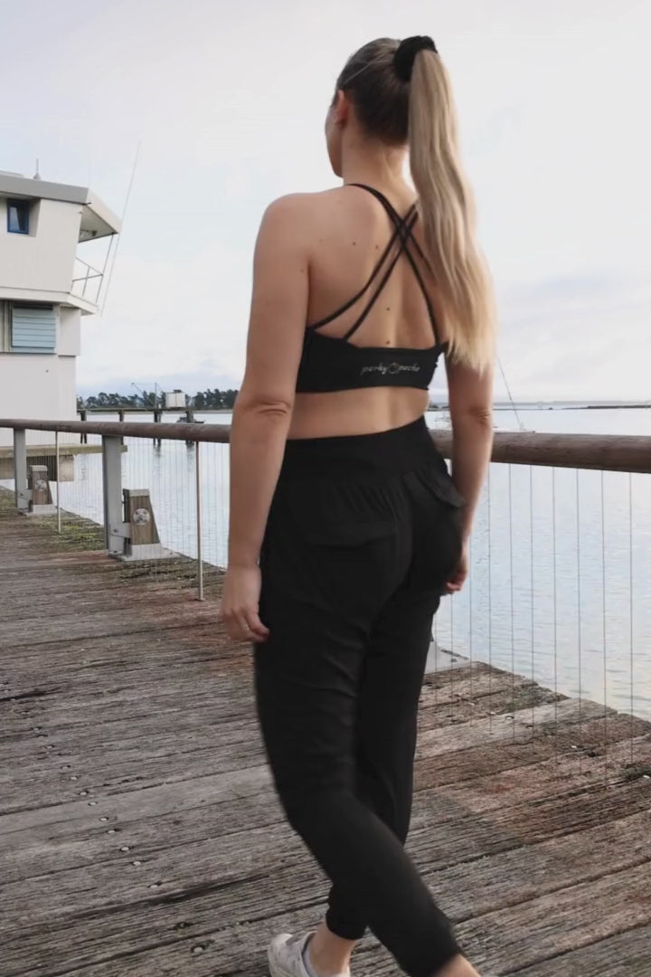 Woman wearing black walking pants