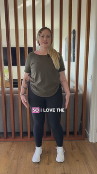 Women wearing green scoop neck t-shirt